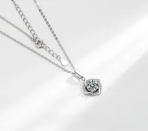 Macro detail of a 925 silver windmill moissanite pendant necklace with elegant claw setting