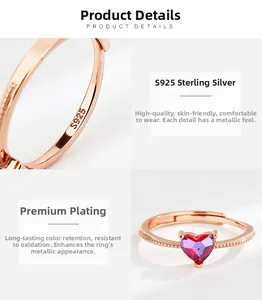 Close-up of S925 sterling silver heart ring with rose gold plating and red gem