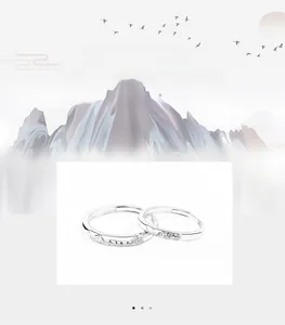 Detailed view of S925 silver couple rings featuring mountain and wave pattern engravings