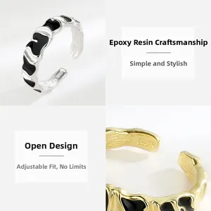 Detail of S925 sterling silver ring featuring irregular wave shape and black drip glue craft