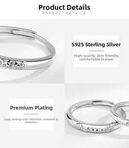 Detail of S925 sterling silver couple ring with relief patterns and micro-inlaid stones