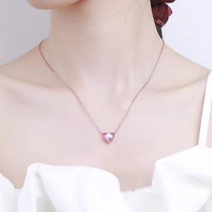 Elegant rose gold heart necklace featuring a faceted pink crystal pendant for women