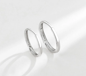 Detailed close-up of polished S925 sterling silver rings with 925 authenticity hallmark