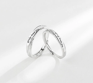 Detailed view of S925 silver Mobius rings with Only love you engraving for couples