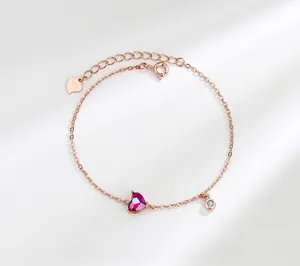 Detailed macro view of S925 sterling silver stamp on rose gold heart charm bracelet