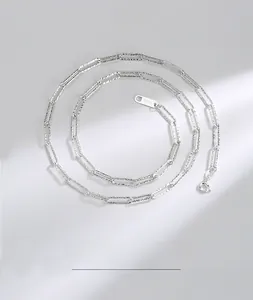 Macro detail of S925 sterling silver rectangular links necklace with textured finish