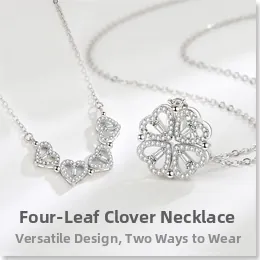 Macro detail of foldable sterling silver clover necklace with magnetic heart charms