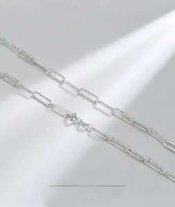 Macro shot of S925 sterling silver paperclip chain with textured Italian cut details