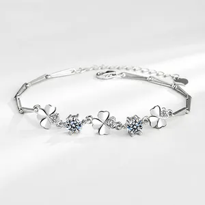 Macro detail of S925 sterling silver four-leaf clover bracelet with zircon stones