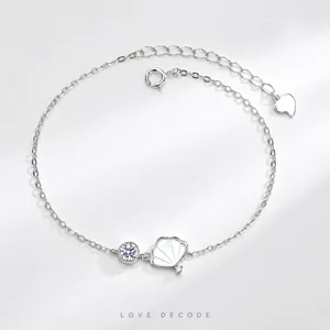 Silver necklace detail with shell pendant and zircon stone on adjustable fine chain link