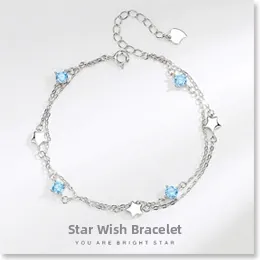 Detail of S925 sterling silver star bracelet with light blue round crystals
