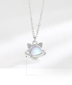 Detailed macro view of S925 silver cat planet pendant with moonstone and sparkling crystals