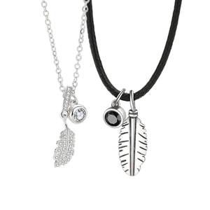 Silver feather couple necklaces with cubic zirconia pendants and black leather cord