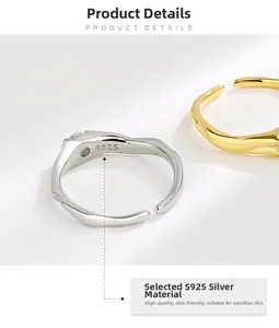 Close-up of S925 sterling silver irregular wave rings showing internal hallmark engraving