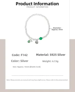 Detail of S925 silver beaded bracelet showing Fu pendant and watermelon charm accents