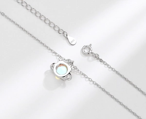 Close-up of S925 sterling silver cat pendant with opal stone and hallmark detail