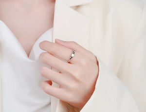Close-up of S925 sterling silver irregular wave ring with a round zircon on a model