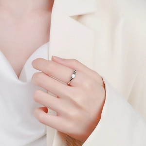 Minimalist S925 sterling silver irregular wavy ring with sparkling round cubic zirconia