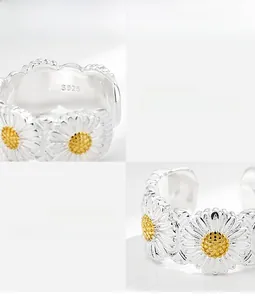 Detailed macro view of S925 sterling silver daisy ring with gold plated flower pistil