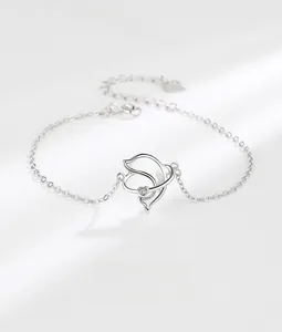 Detailed close-up of S925 silver dolphin bracelet with white mother of pearl inlay