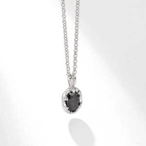 Elegant S925 sterling silver necklace with a black zircon pendant on a white background