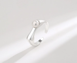 Close-up of minimalist S925 silver adjustable ring with a round white freshwater pearl