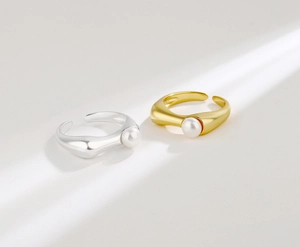 Macro detail of S925 sterling silver adjustable rings with elegant freshwater pearls