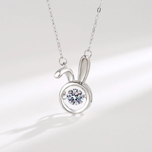 Elegant S925 sterling silver rabbit necklace with dancing zircon stone on white background