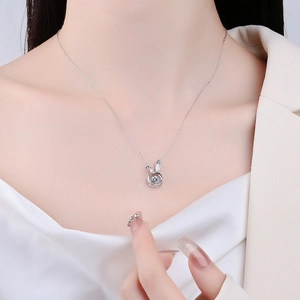 S925 sterling silver dancing rabbit necklace with sparkling cubic zirconia on model