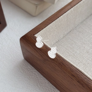Elegant S999 sterling silver gourd stud earrings with a sparkling hexagonal texture pattern