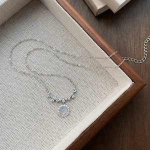 Elegant S925 sterling silver necklace with round moonstone pendant and zircon halo