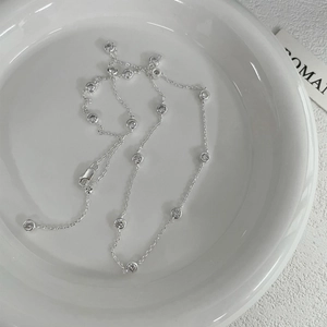 Minimalist S925 sterling silver necklace with bezel-set cubic zirconia round stones