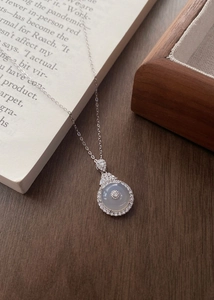 Detailed macro view of S925 silver necklace featuring chalcedony pendant and crystal halo