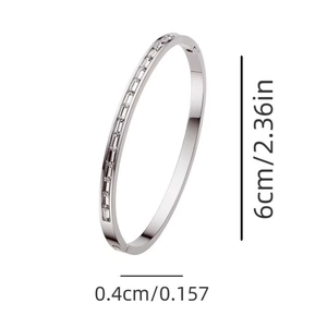 Silver stainless steel bangle with baguette zirconia stones and clear dimension markings