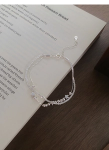 Macro detail of S925 sterling silver double-layer star bracelet with adjustable extender