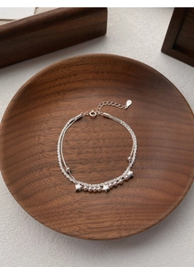Detail of S925 sterling silver double-layer star bracelet with S925 hallmark tag