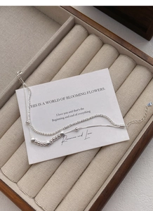 Close-up of S925 sterling silver double-layer bracelet with star charms and S925 hallmark