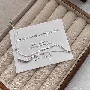 Double-layer S925 sterling silver star bracelet with beads and charms on jewelry box