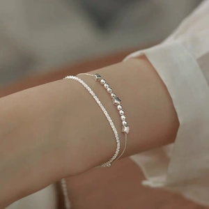S925 sterling silver double-layer star bracelet set on woman wrist with minimalist design
