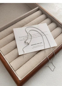 Detail view of S925 sterling silver Chopin chain with adjustable bead and needle tip