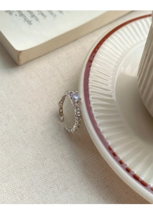 Detailed view of S925 sterling silver textured ring with a pale purple zircon gemstone