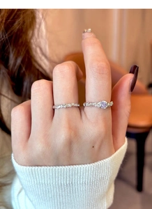 Close-up of S925 sterling silver rings featuring hammered texture and a lavender zircon