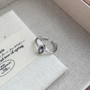 925 silver irregular textured ring featuring a dark teardrop sapphire and open band design