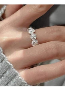 Detail of vintage matte S925 silver rose flower open ring worn on a finger