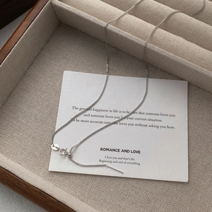 Minimalist S925 sterling silver Chopin chain necklace on jewelry tray with card