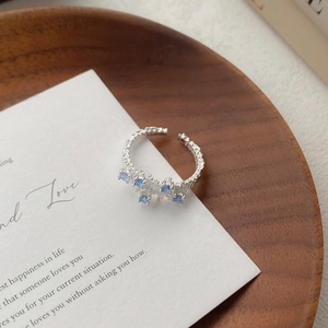 S925 sterling silver adjustable ring with irregular texture and light blue zircons