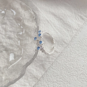 Irregular textured S925 sterling silver ring featuring blue zircon stones and diamonds