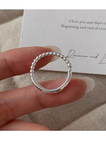 Detailed close-up of S925 silver ring featuring unique beaded and smooth split design