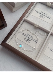 Detail of S925 sterling silver double-layer bracelet with heart moonstone in jewelry box