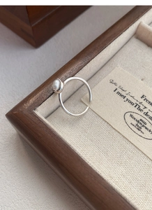 Detailed macro view of S925 sterling silver open ring with white oval gemstone inlay